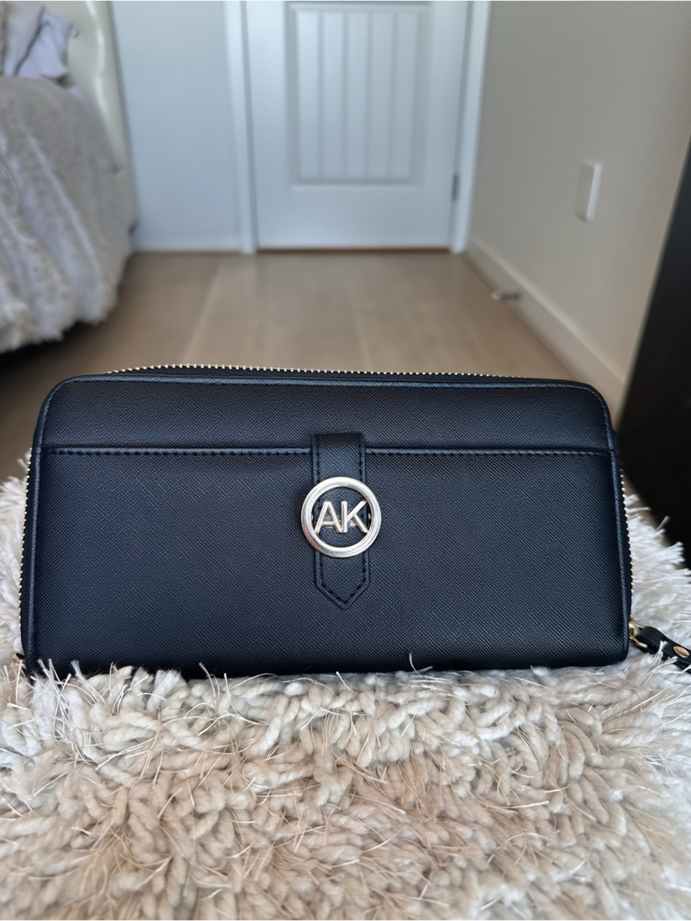 Anne Klein Black Zip-Around Saffiano Wallet with AK Emblem